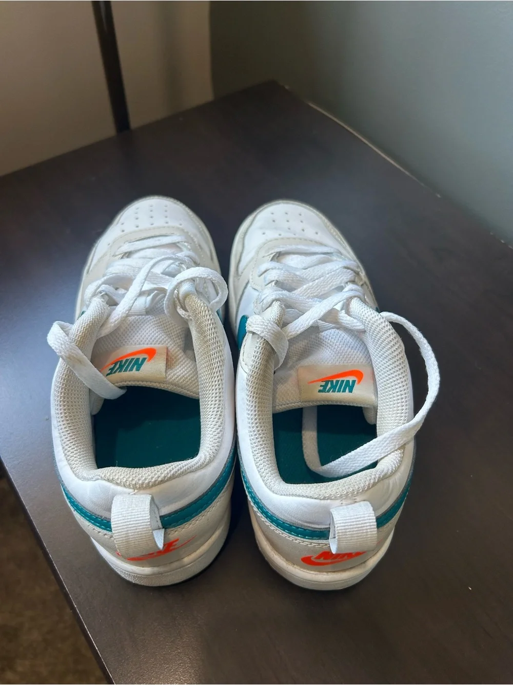 Nike White Low-Top Sneakers with Teal Swoosh Accent